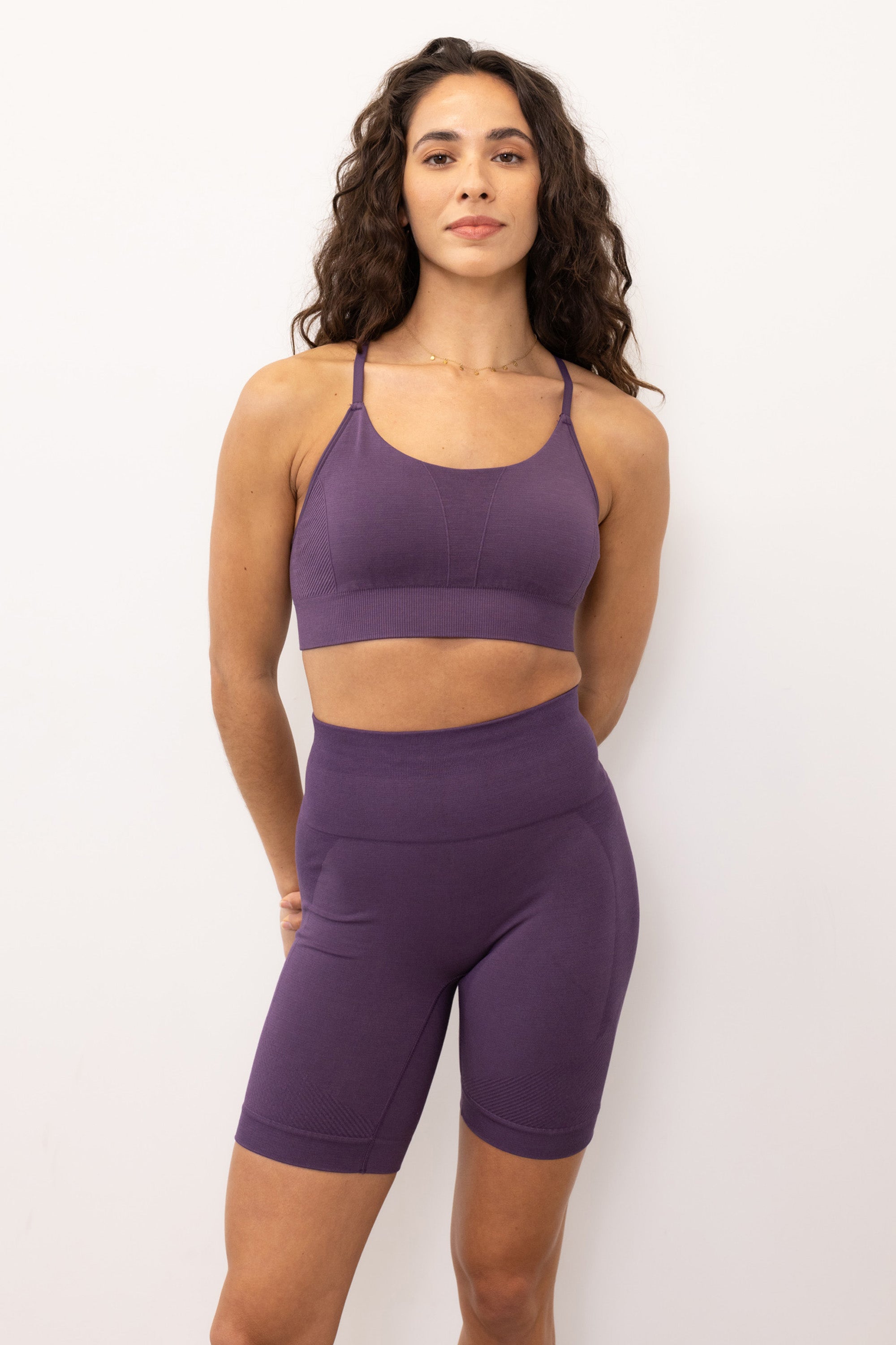Purple ribbed recycled modal shorts and padded supportive sculpting sports bra for running, yoga, gym and pilates from sustainable activewear brand Jilla Active  Edit alt text