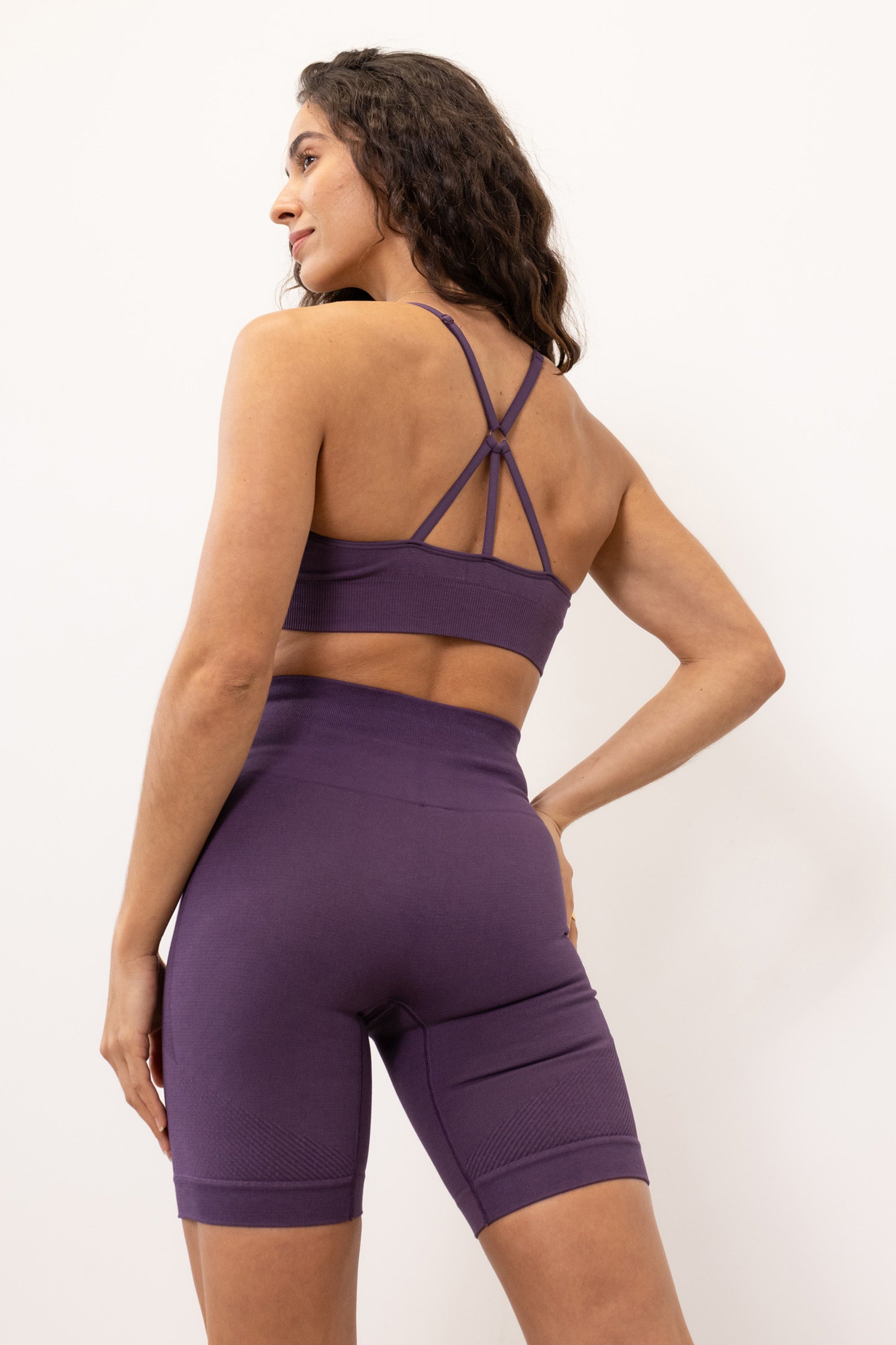 Purple ribbed recycled modal shorts and padded supportive sculpting sports bra for running, yoga, gym and pilates from sustainable activewear brand Jilla Active  Edit alt text
