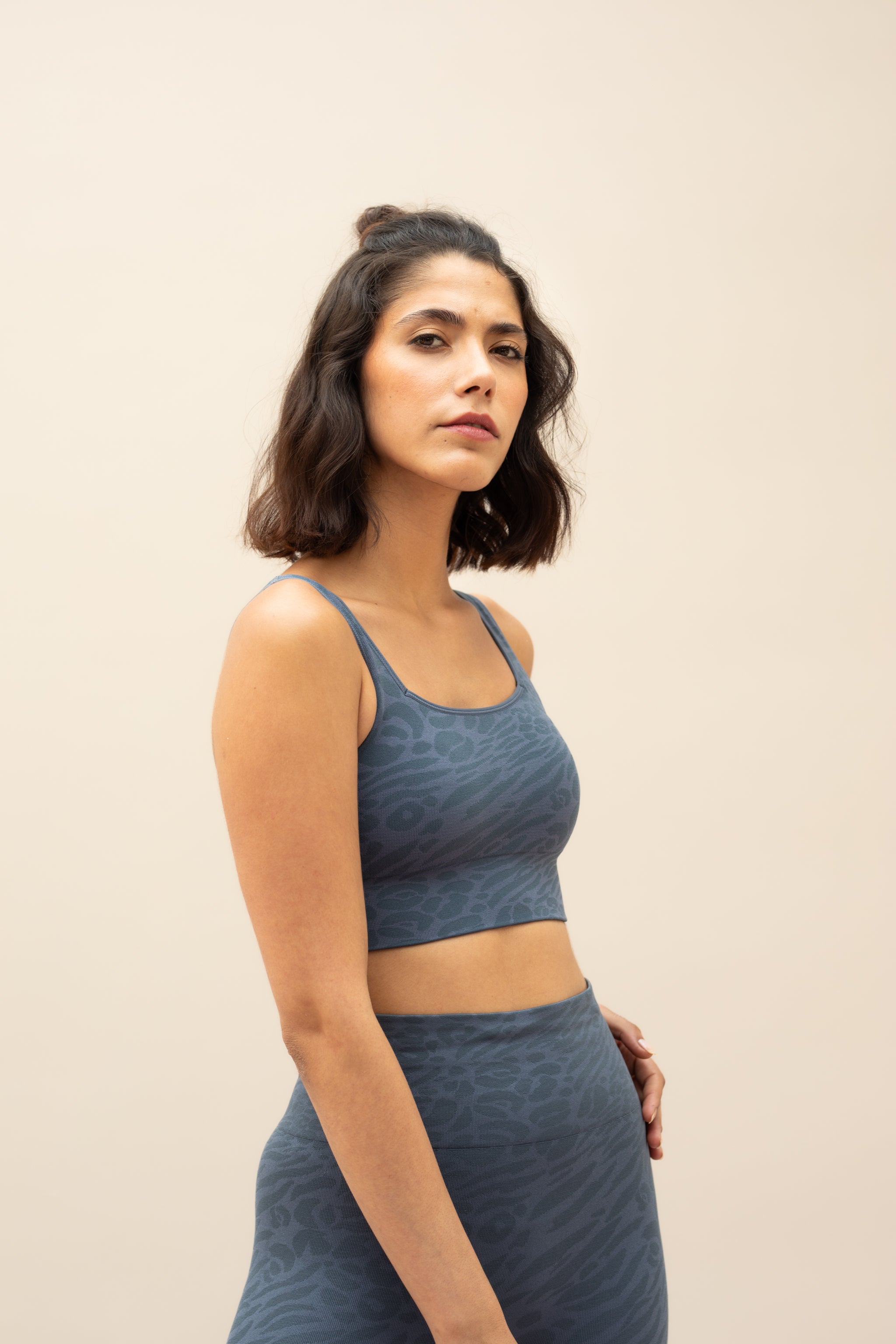 Blue leggings and blue recycled sports bra for sustainable activewear brand, Jilla.