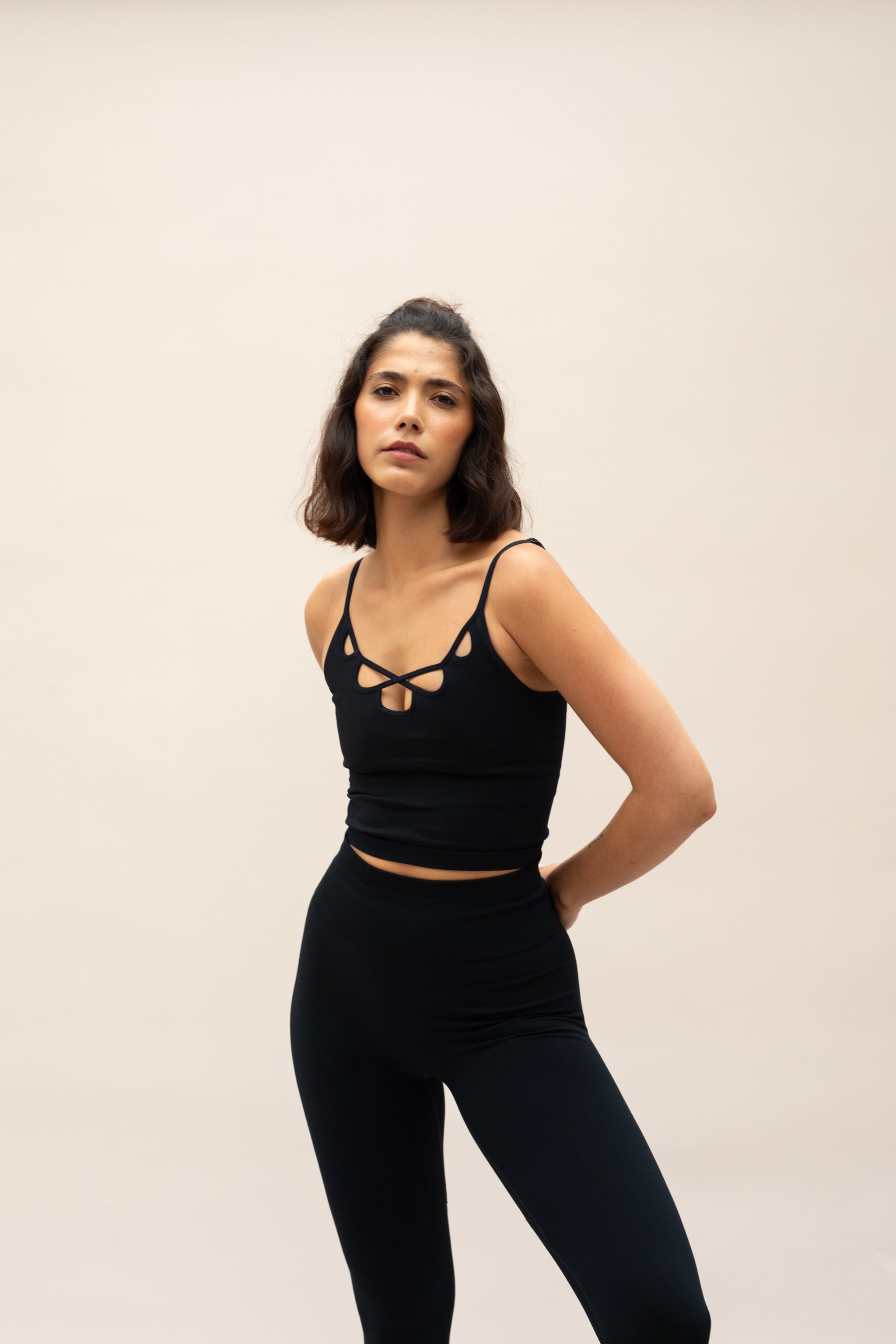 Model wearing black top and black leggings for sustainable activewear Jilla