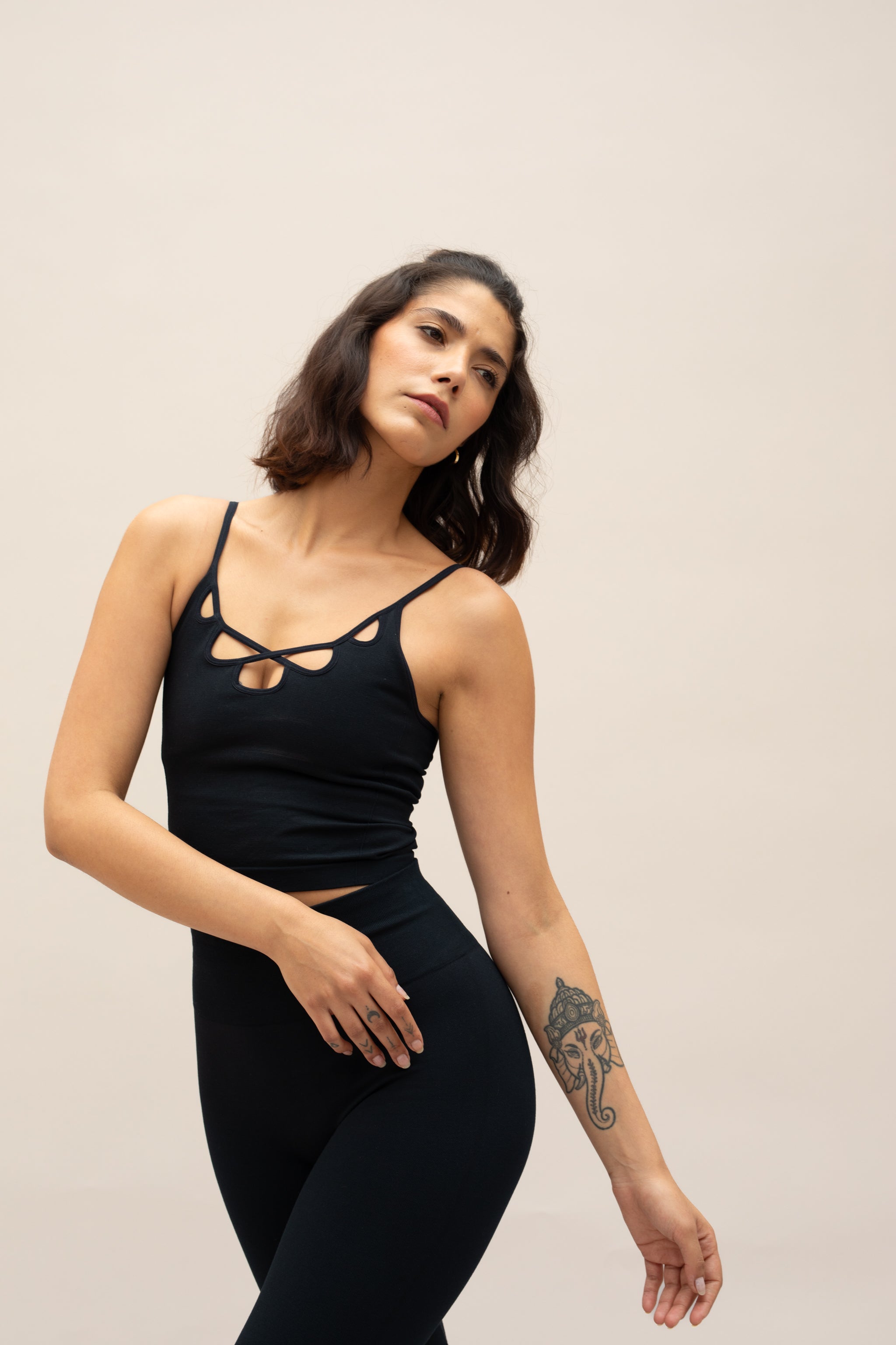 Model wearing black top and black leggings for sustainable activewear Jilla
