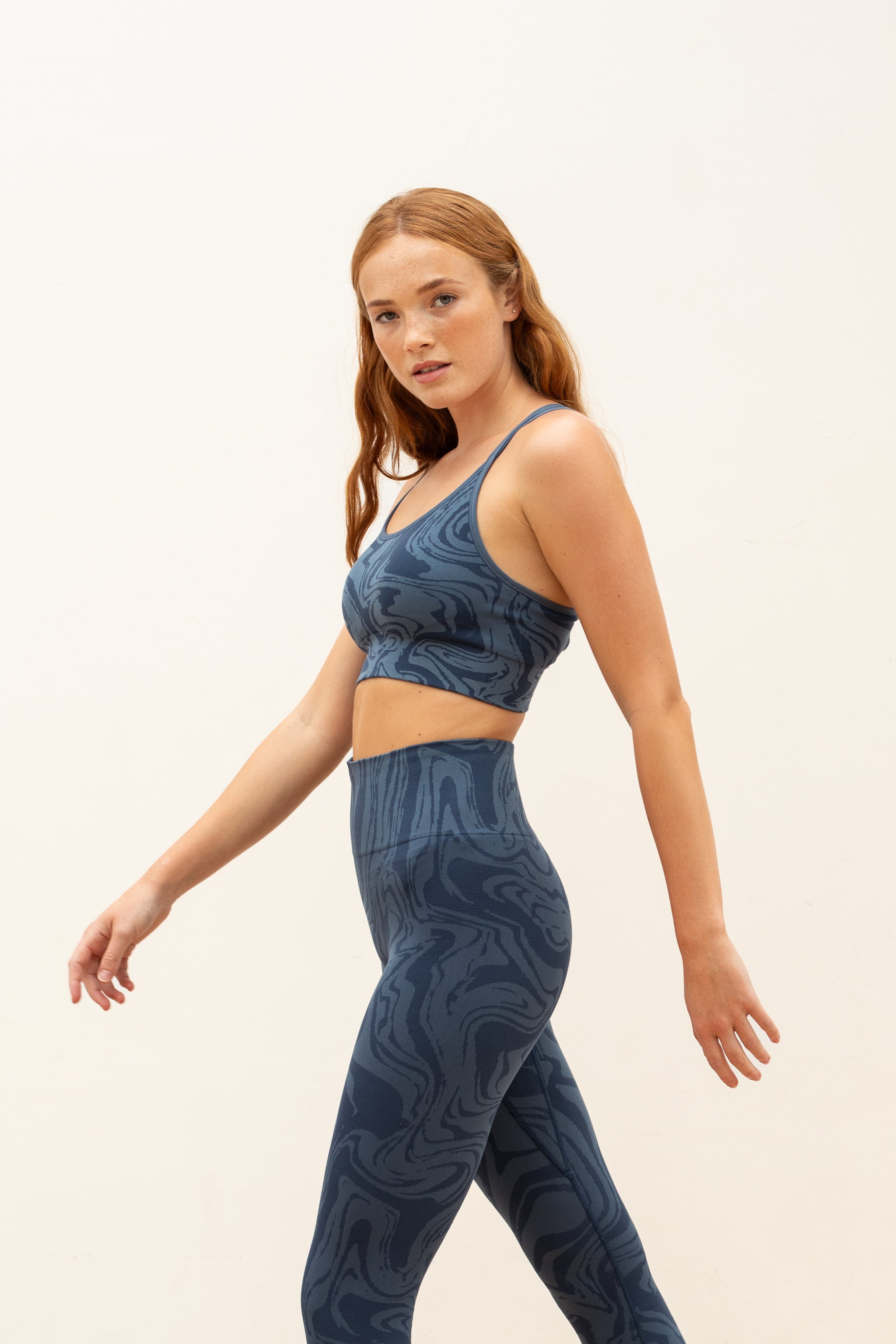 Denim blue recycled seamless marble print low to medium impact supportive sports bra for yoga, pilates, spinning, weights, running and exercise by sustainable activewear brand Jilla Active 