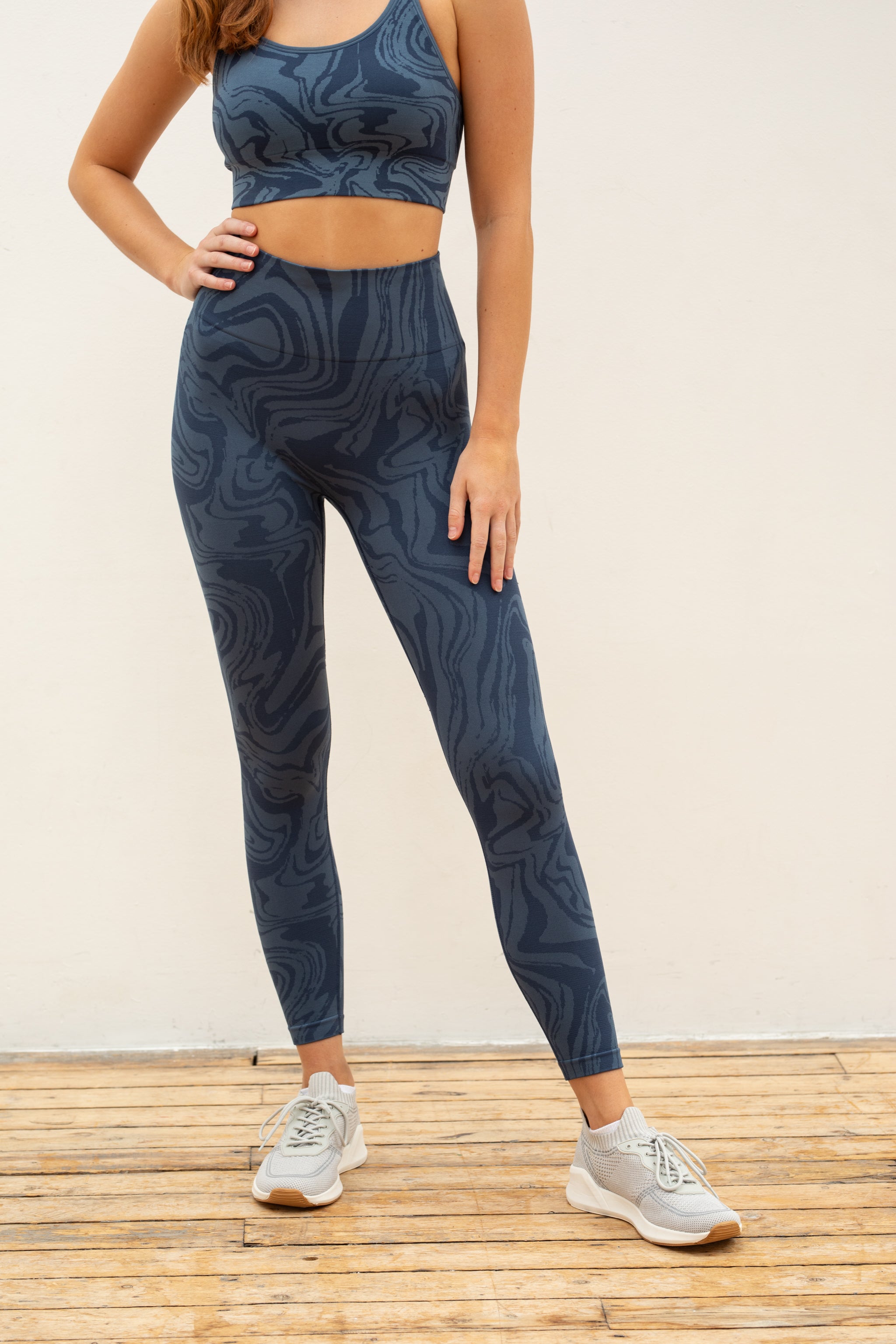 Denim blue recycled seamless marble jacquard print full length high rise sculpting compressive leggings for yoga, pilates, barre, spinning, running, cycling and exercise by sustainable activewear brand Jilla Active