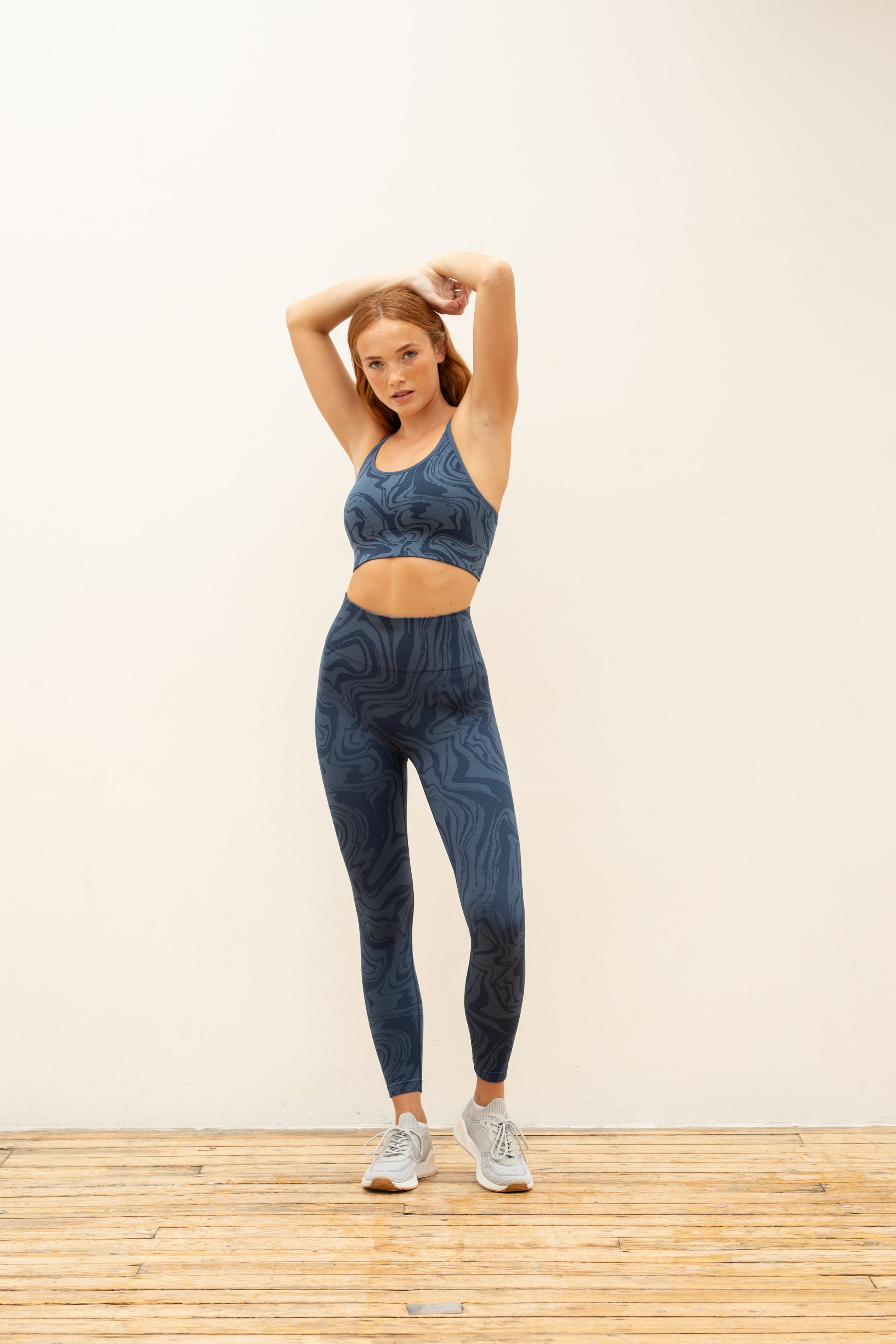 Denim blue recycled seamless marble jacquard print full length high rise sculpting compressive leggings for yoga, pilates, barre, spinning, running, cycling and exercise by sustainable activewear brand Jilla Active