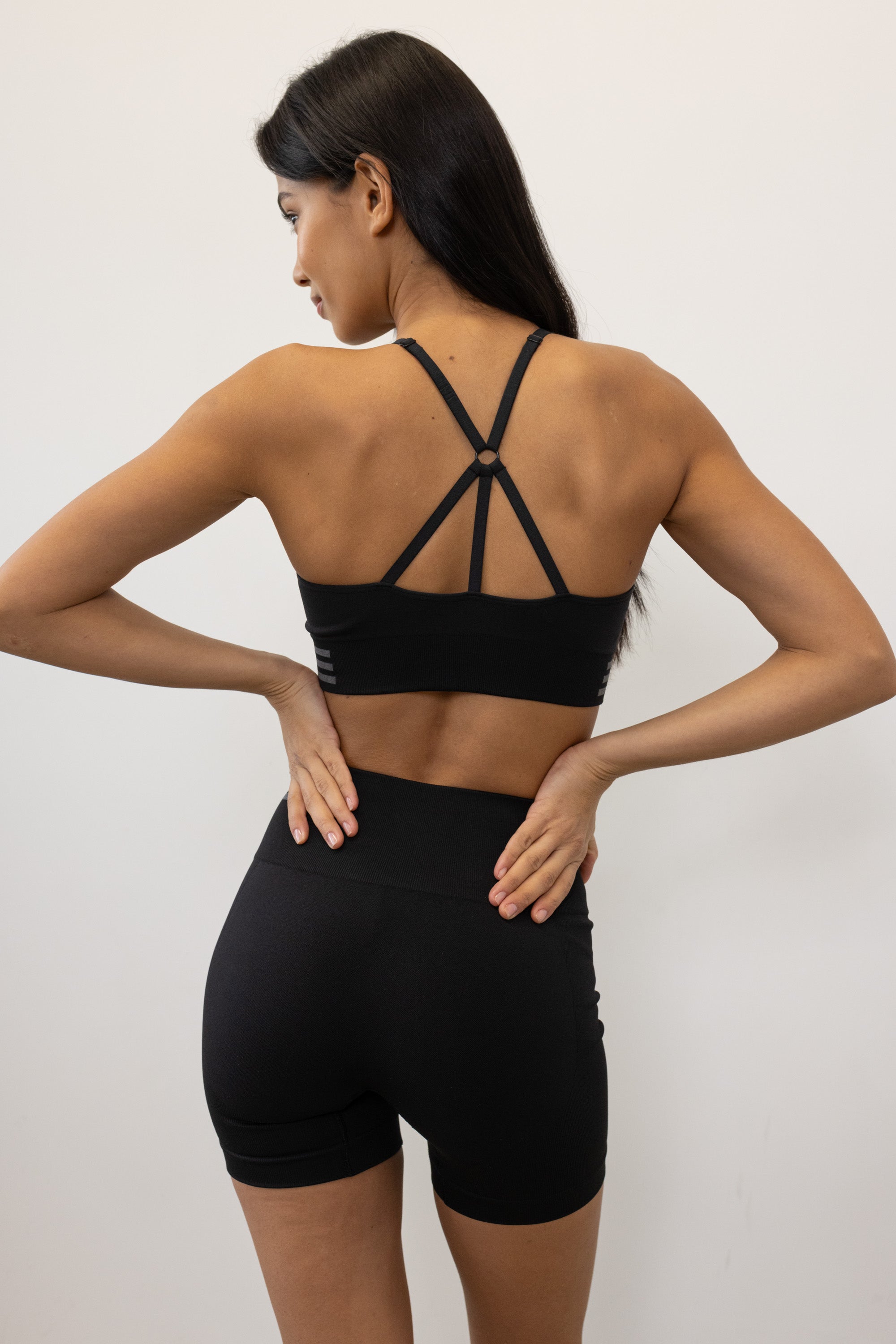 Introducing our black Tone & Lift Recycled Shorts: Your go-to for summer workouts! Made with four-way stretch fabric and ribbing panels, they offer a flattering fit for any activity. Featuring a high-rise ribbed waistband and 5" inseam, they ensure comfort and style. With contrasting colors and internal elastic, they're both fashionable and functional. Pair with our matching bra and Sky's The Limit Oversized T-shirt for a complete look. Sustainable activewear by Jilla Active