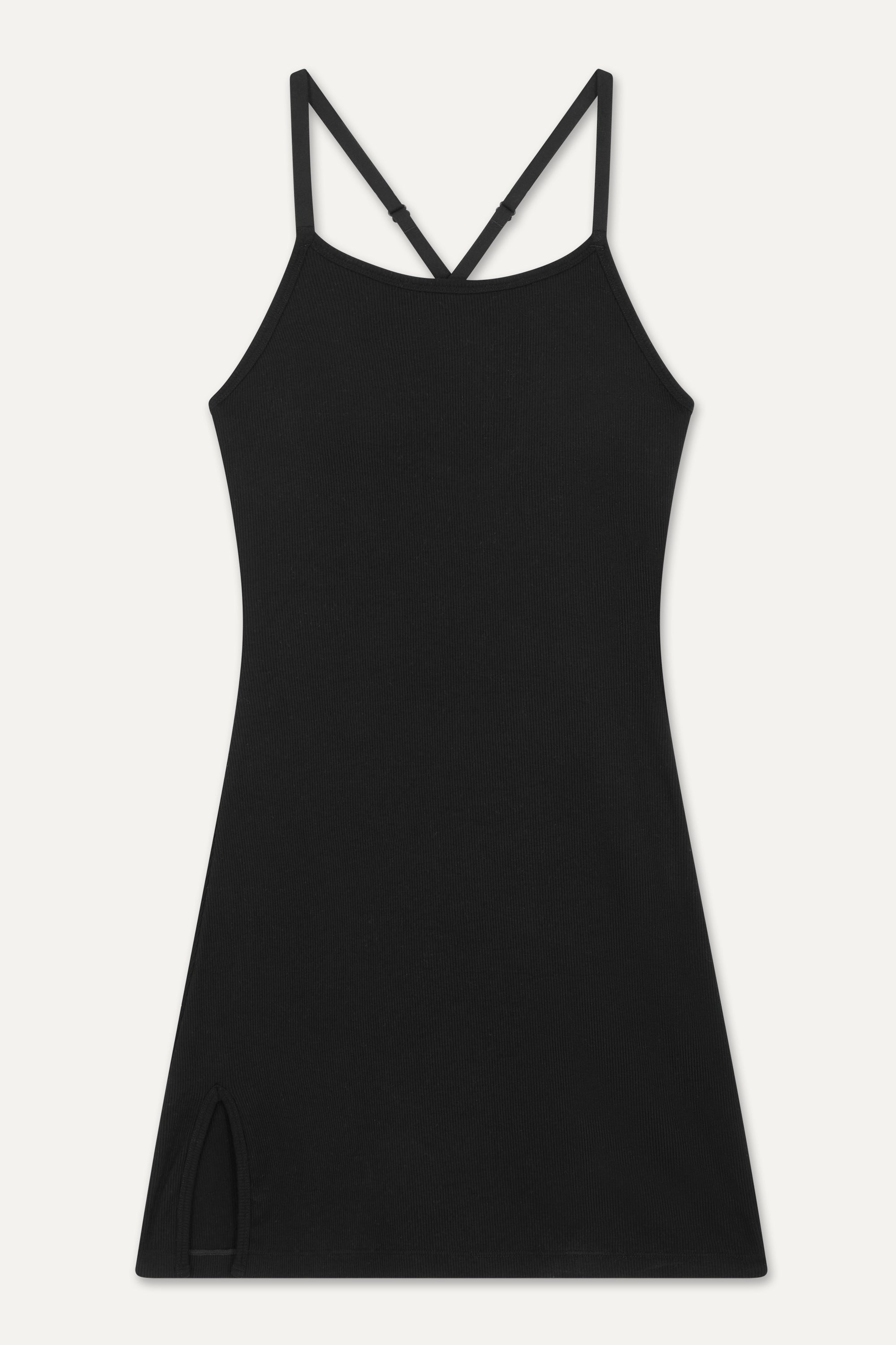 Summer-ready in our black Movement Court Dress from sustainable activewear brand Jilla Active! From the tennis court to street style, it's versatile. Featuring a full lining with shelf bra and shorts, plus adjustable straps and removable pads for a customized fit. Complete your look with chunky socks and trainers.