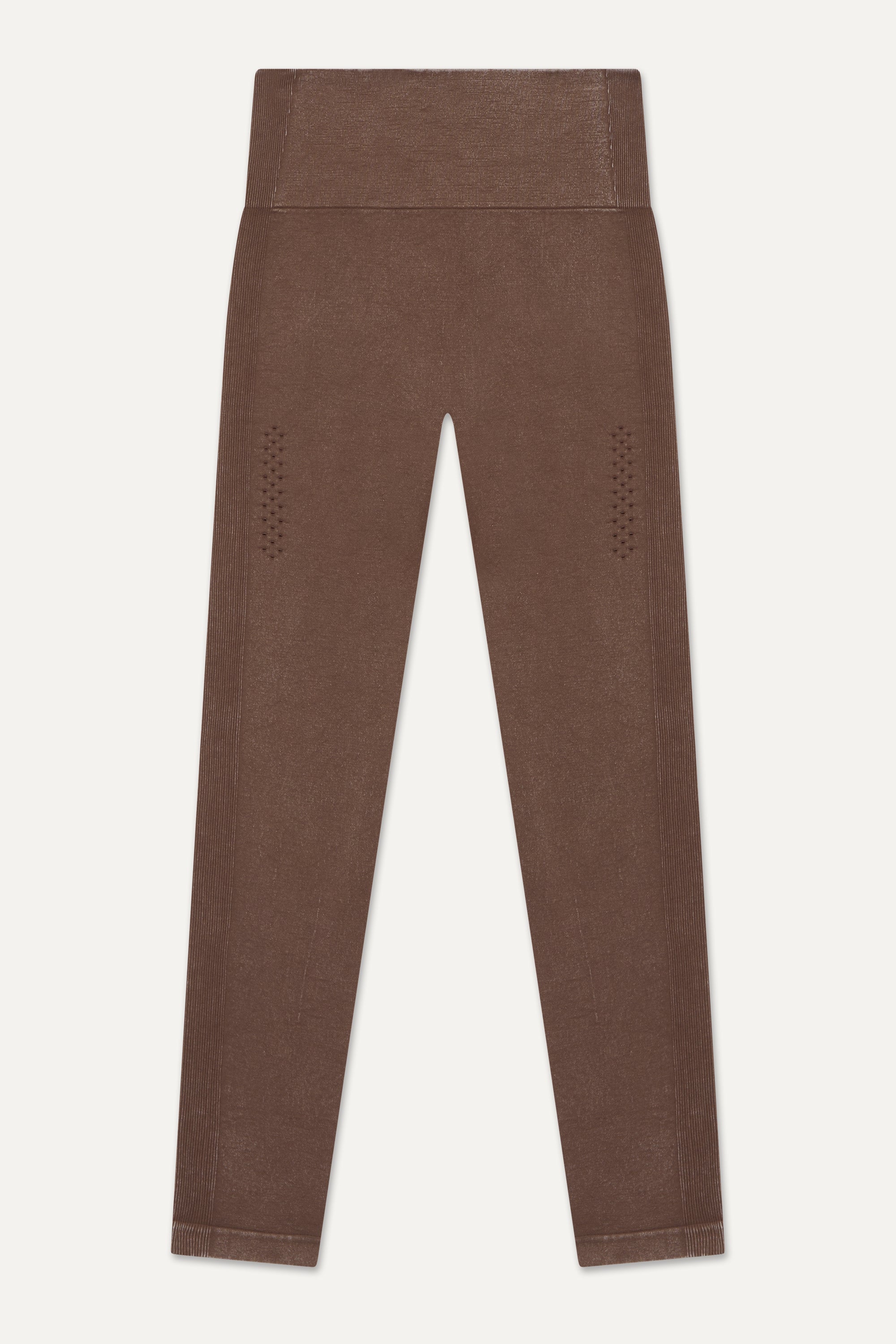 Our brown Aquarius Recycled Leggings - crafted for seamless performance in your yoga flows, barre workouts, and reformer classes. Made from four-way stretch fabric, they move effortlessly with you. Designed with flattering ribbing and an acid wash effect, each pair is unique. The high-rise ribbed waistband with internal elastic ensures they stay in place during your entire class, while the double-layered gusset provides all-day comfort and flexibility. Elevate your activewear game with Jilla Active