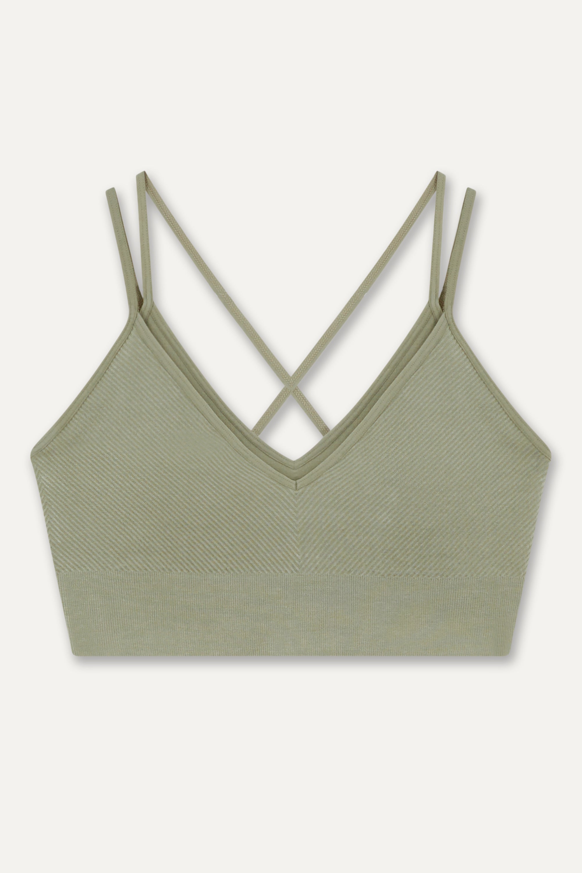 Introducing our Mandala Modal Yoga Bra crafted for style and comfort in low impact workouts. With a feminine double layered design, crossover straps, and textured detail, it offers both fashion and function. Seamlessly knitted in soft Lenzing Modal fabric, recycled polyamide, and elastane, it provides flexible support for yoga, pilates, and barre. With light support, triple-layered fabric, and removable pads, it ensures comfort and customization.