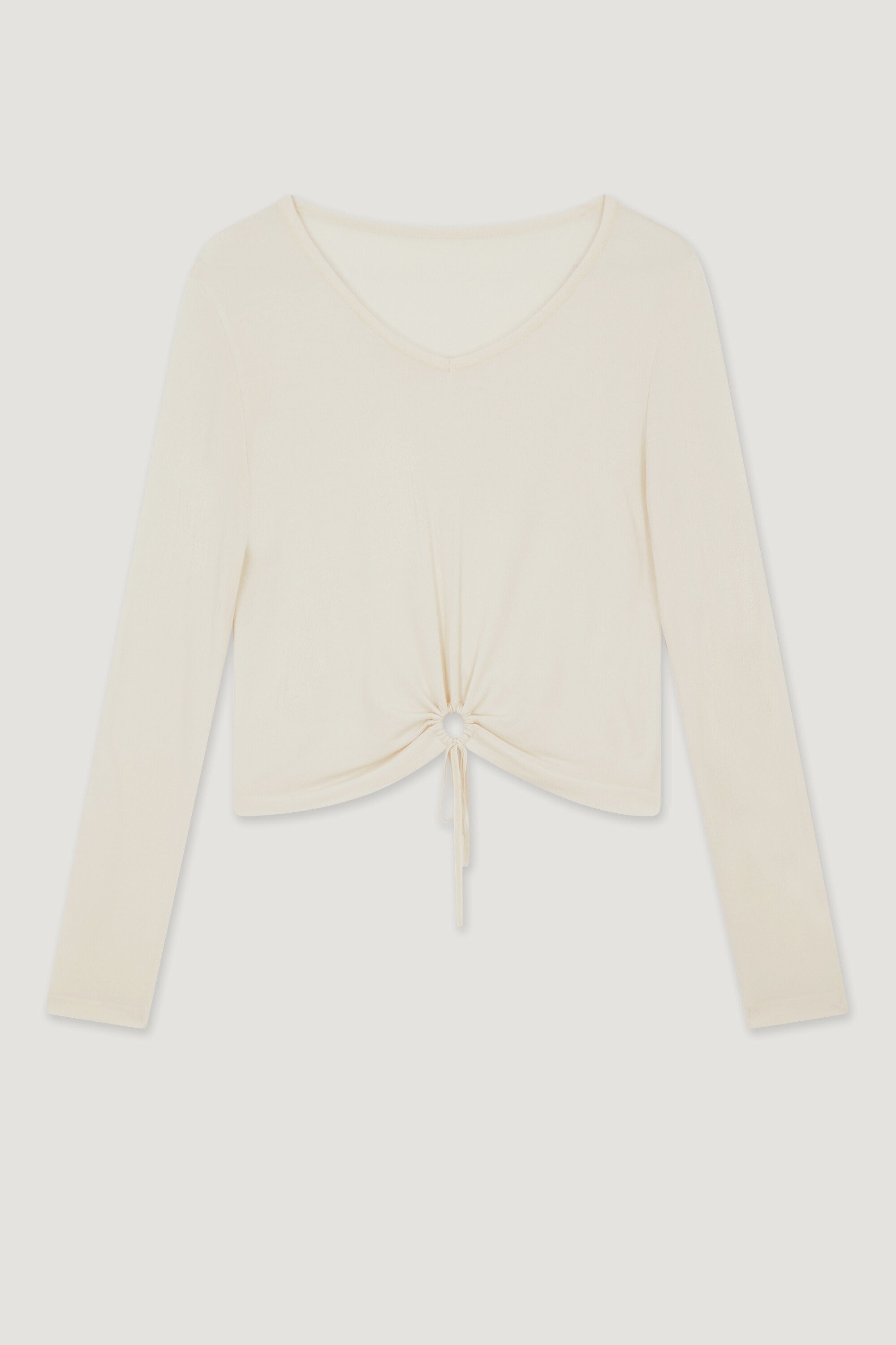 Light cream beige V neck bamboo recycled fabric long sleeve top with cooling and moisture wicking properties for yoga, barre, pilates, gym, and exercise.