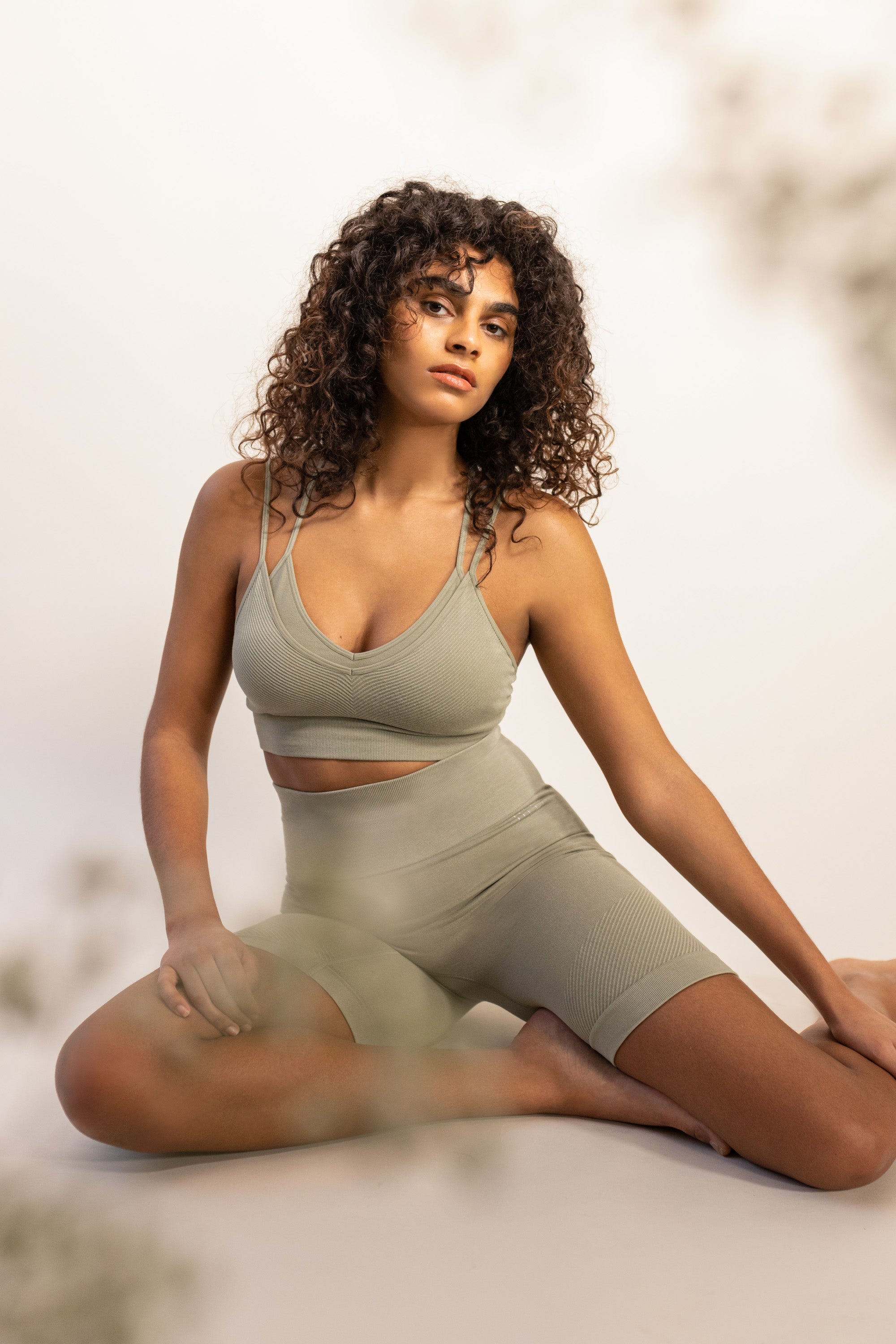 Introducing our Mandala Modal Yoga Bra crafted for style and comfort in low impact workouts. With a feminine double layered design, crossover straps, and textured detail, it offers both fashion and function. Seamlessly knitted in soft Lenzing Modal fabric, recycled polyamide, and elastane, it provides flexible support for yoga, pilates, and barre. With light support, triple-layered fabric, and removable pads, it ensures comfort and customization.