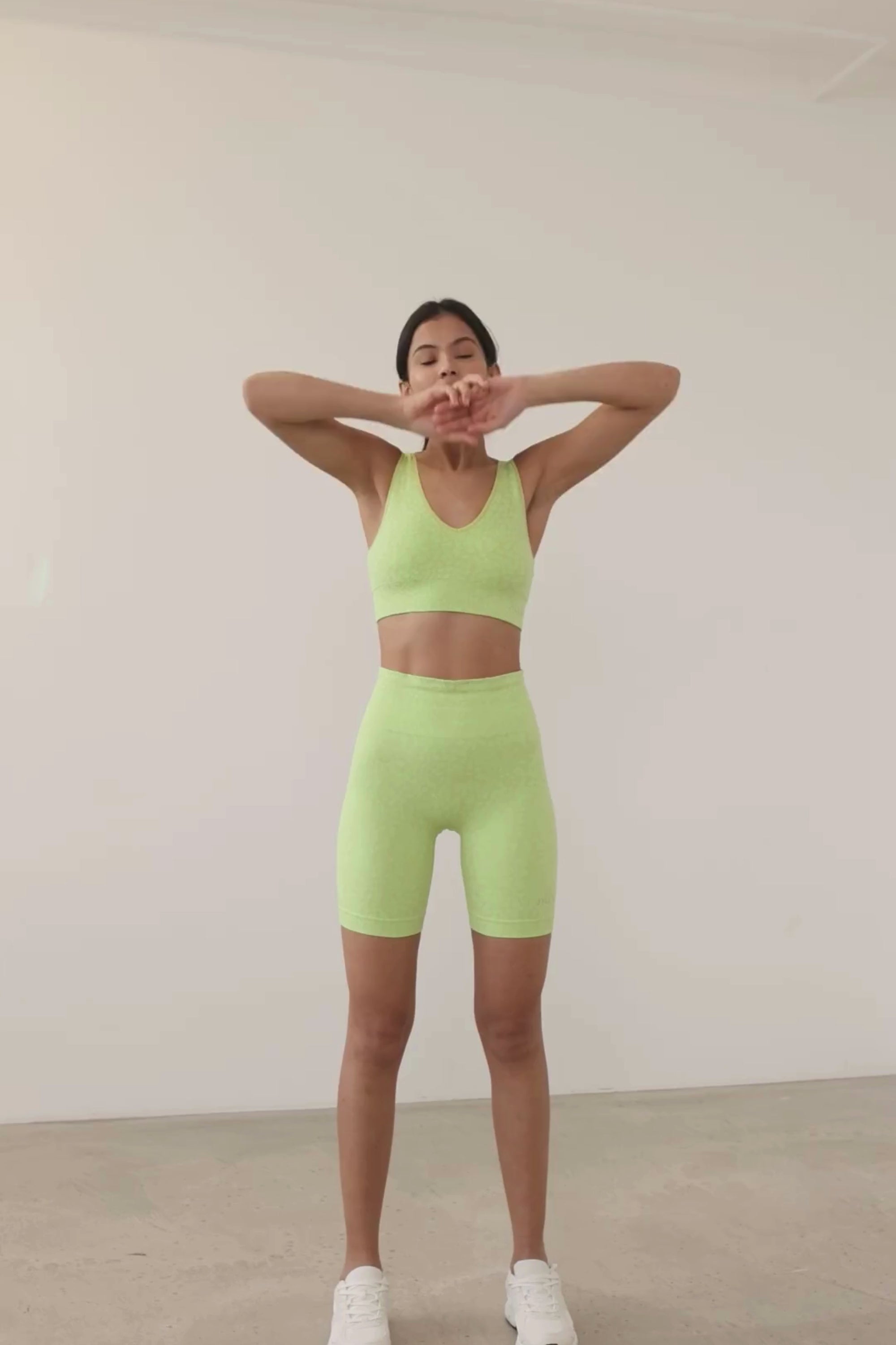 Prepare for summer with our Sahara Recycled Shorts in lime acid green, seamlessly knitted in our new animal jacquard. With a wide ribbed waistband and a mid-thigh finish, they're perfect for studio classes, gym workouts, and everyday style. The internal waistband elastic and four-way stretch fabric ensure they stay in place all day. Complete your look by pairing them with the matching bra and oversized tee.
