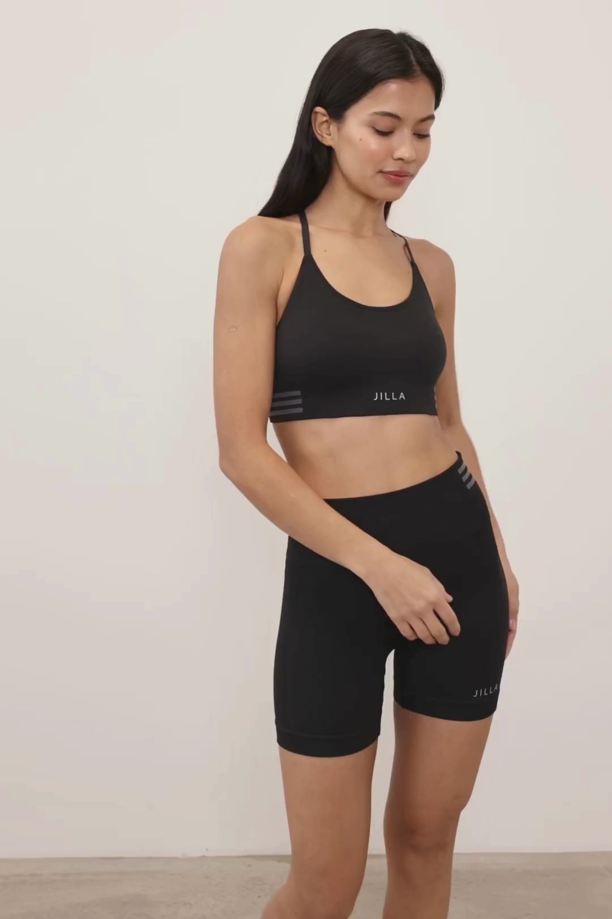Introducing our black Tone & Lift Recycled Shorts: Your go-to for summer workouts! Made with four-way stretch fabric and ribbing panels, they offer a flattering fit for any activity. Featuring a high-rise ribbed waistband and 5" inseam, they ensure comfort and style. With contrasting colors and internal elastic, they're both fashionable and functional. Pair with our matching bra and Sky's The Limit Oversized T-shirt for a complete look. Sustainable activewear by Jilla Active