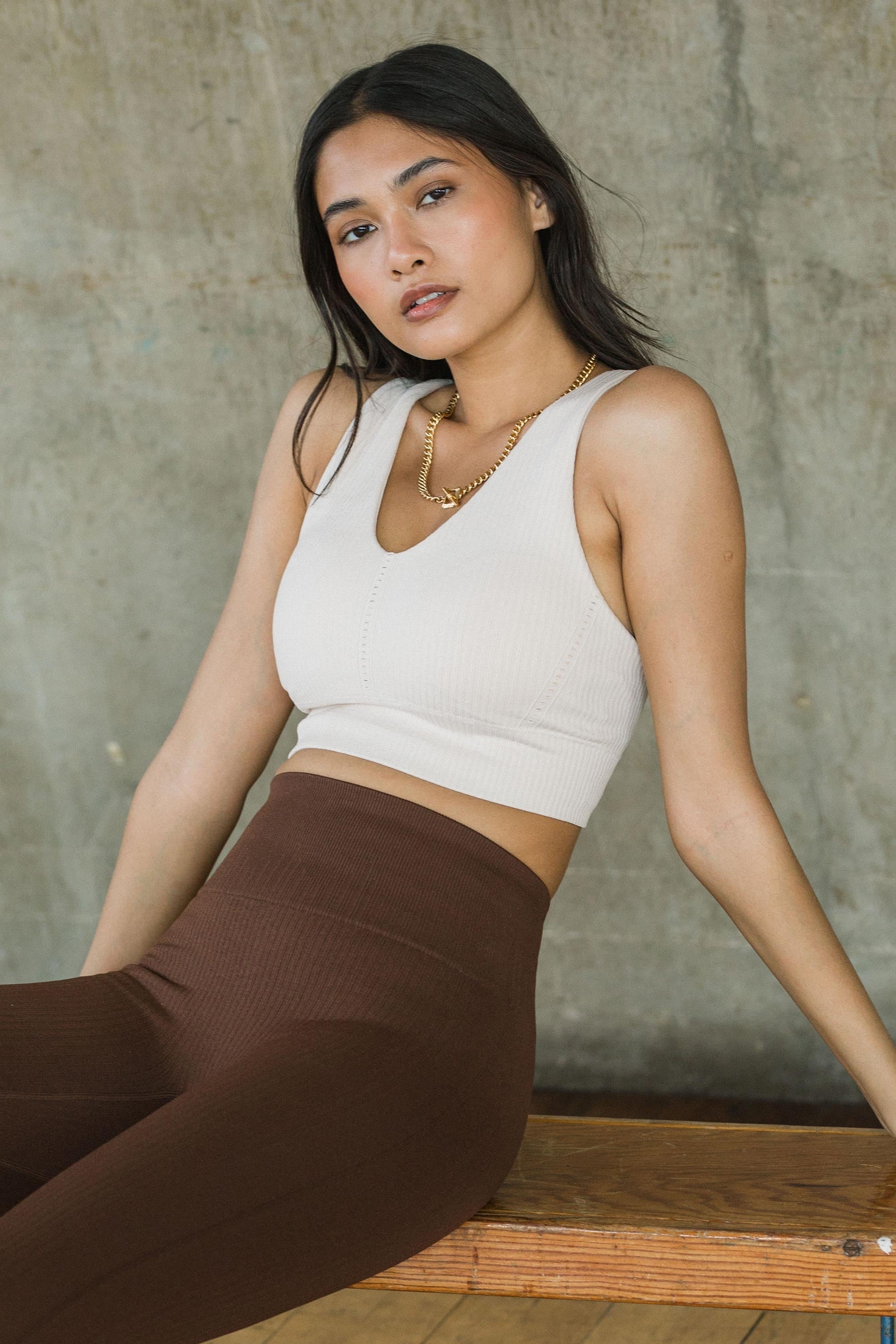  Cream beige white ribbed supportive sports bra top and brown high rise leggings for yoga, pilates, running, barre and gym by sustainable activewear brand Jilla Active